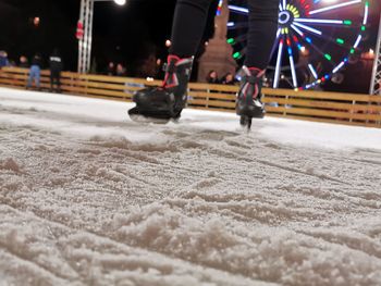 People on street in winter at night