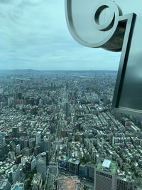 High angle view of modern buildings in city against sky