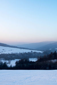 Scenic view of frozen landscape against clear sky