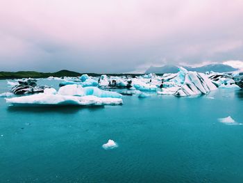 Scenic view of frozen sea against sky