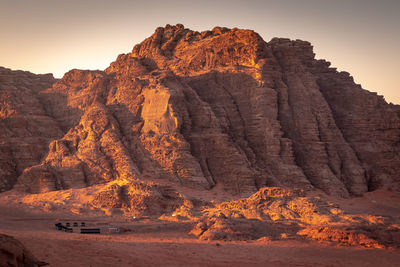 Rock formation on land against sky