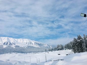 Scenic view of snowcapped mountains against sky