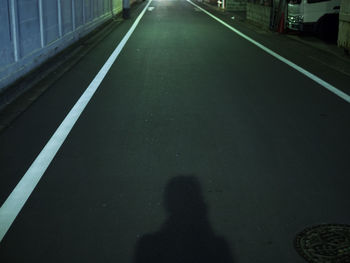 Shadow of people on street