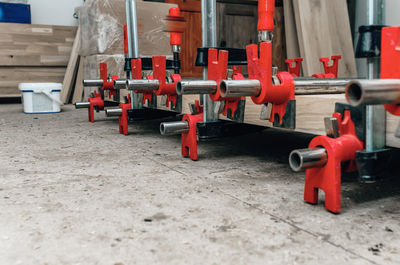 Wooden board in carpentry workshop. joiner's clamp. wood shavings, sawdust