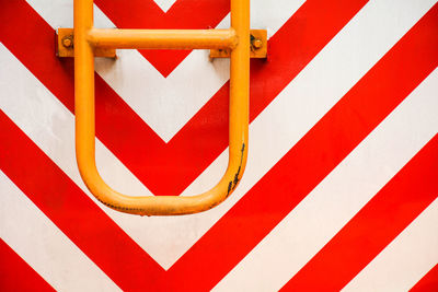 Close-up of red sign on metal