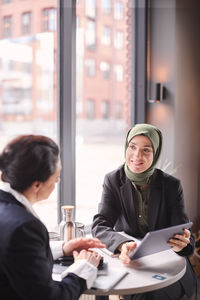 Two businesswomen sitting in cafe