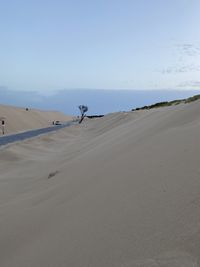 Scenic view of desert against clear sky