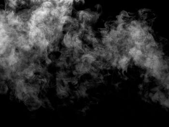 Abstract image of smoke against black background