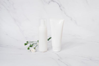 Close-up of beauty products on snow