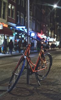 Bicycle on city street at night