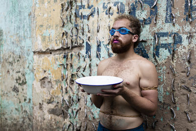 Man performs protest performance at the sao joaquim fair in salvador. 