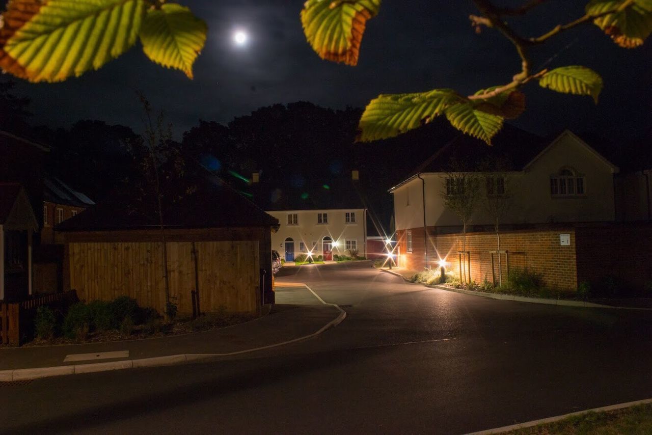 ILLUMINATED HOUSES AT NIGHT