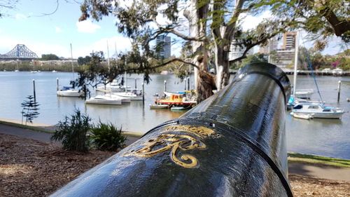 Boats in river with buildings in background