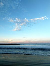 Scenic view of beach at sunset