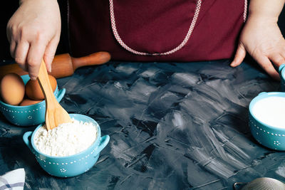 Midsection of woman preparing food