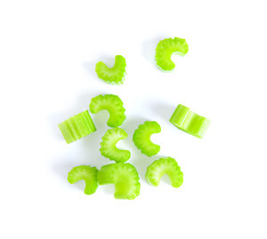 High angle view of green beans against white background