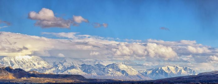 Scenic view of snowcapped mountains against sky