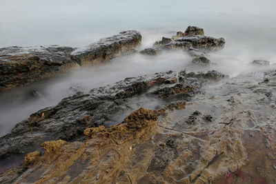 Scenic view of rock formation in sea