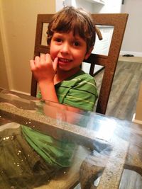 Portrait of smiling boy at home