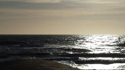 Scenic view of sea at sunset