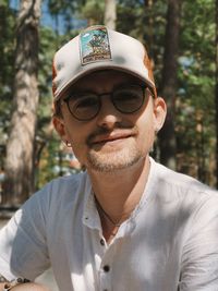 Portrait of man wearing sunglasses standing outdoors