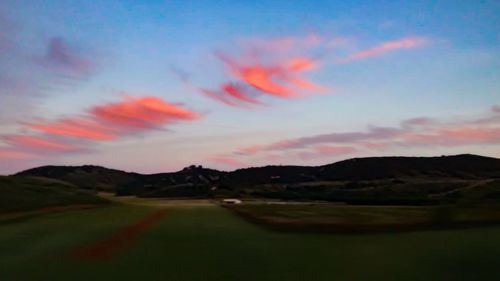 Scenic view of landscape against sky during sunset