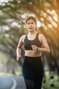 Young woman exercising at park