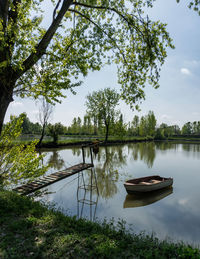 Boat in lake against sky