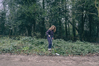 Young woman hiking in forest