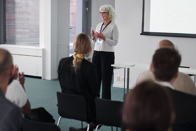 Woman having presentation during business meeting