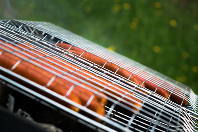 Close-up of sausages on barbecue grill