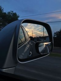Reflection of car on side-view mirror