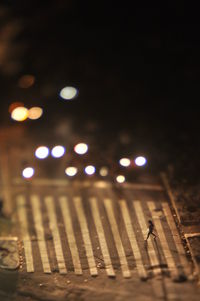 Close-up of illuminated street lights at night