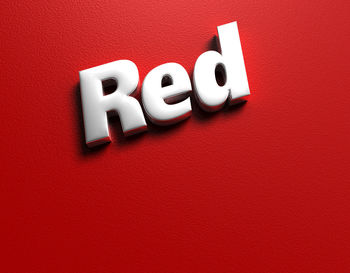Close-up of text written on red background