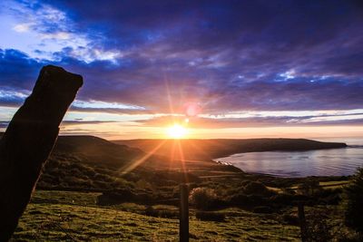 Scenic view of sunset over calm sea