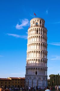 Low angle view of historical building against blue sky