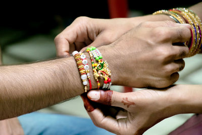 Close-up of couple holding hands