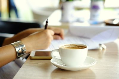 Coffee cup on table at cafe