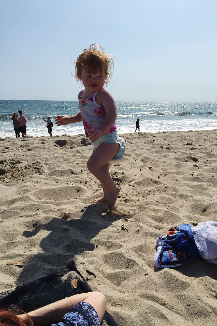 beach, sand, sea, shore, leisure activity, lifestyles, water, vacations, childhood, boys, horizon over water, summer, sunlight, elementary age, girls, nature, enjoyment, togetherness, day