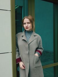 Portrait of young woman standing outdoors