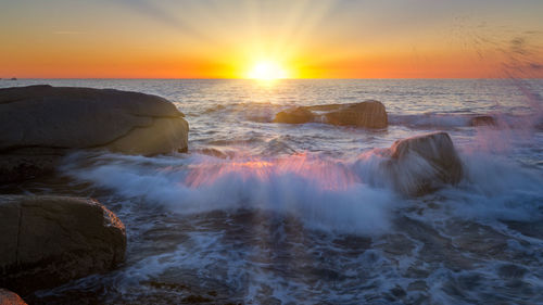 Scenic view of sea against sky during sunset