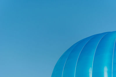 Low angle view of balloon against clear blue sky