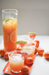 Close-up of juice served with drink on table