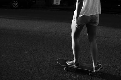 Low section of teenage girl skating