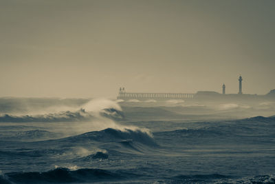 Scenic view of sea against sky during sunset whitby rough seas