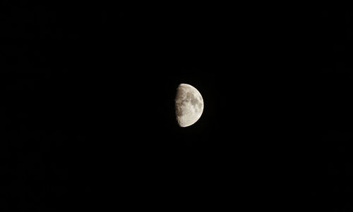 Low angle view of moon against sky at night