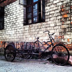 Luggage cart on street by house