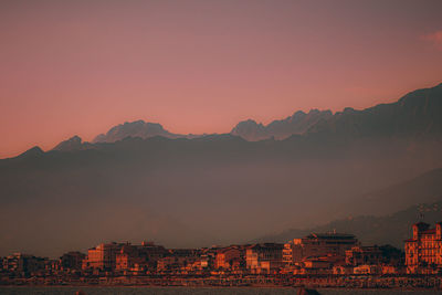 Scenic view of mountains against clear sky during sunset
