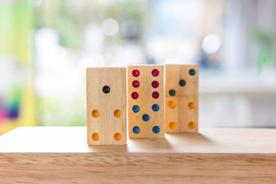 Close-up of wooden dices on table