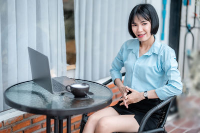 Young woman using mobile phone